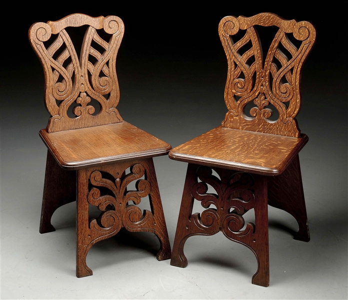 PAIR OF CARVED OAK CHAIRS W/ CUTOUTS.