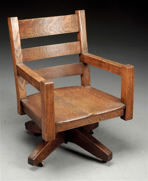 MISSION ROLLING OFFICE ARMCHAIR W/ CARVED SADDLE SEAT.