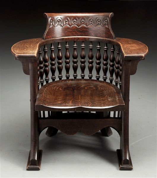 CARVED BARREL CHAIR W/ TURNED SPINDLES.