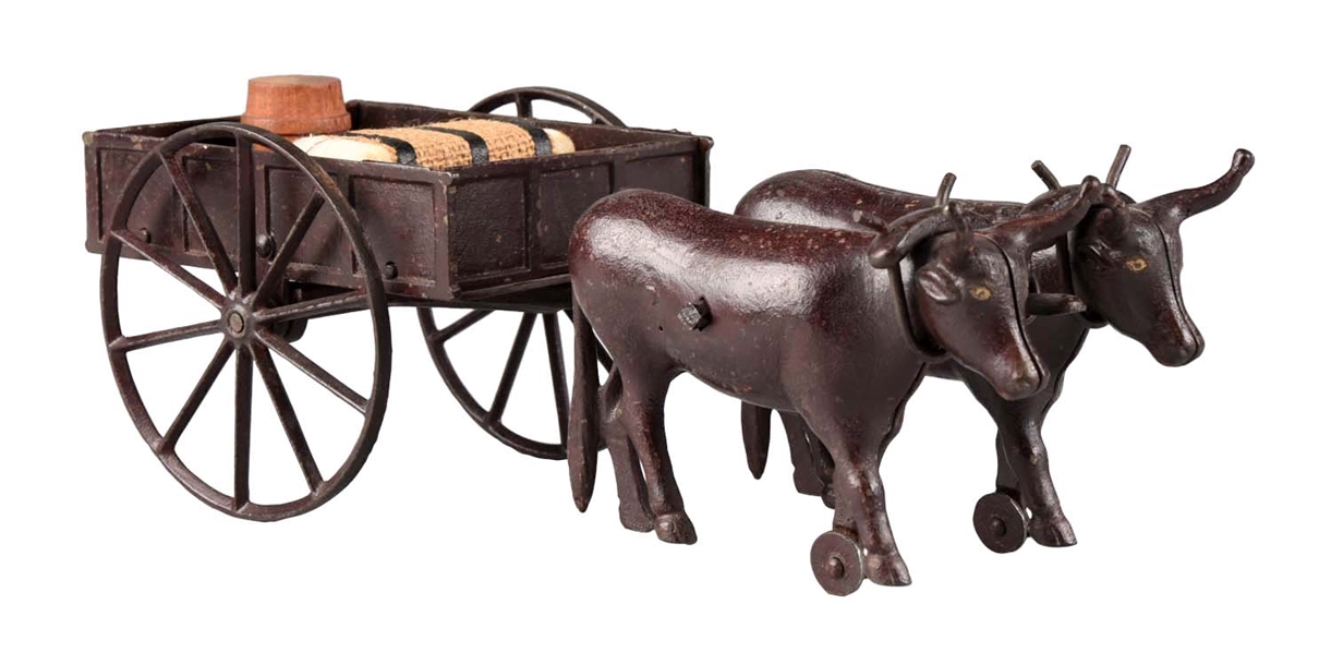RARE IVES TWO OXEN DRAWN CAST IRON CART.  