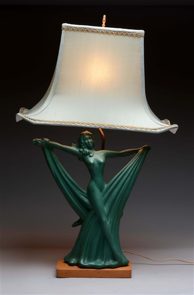 FIGURAL ART NOVEAU POTTERY LAMP WITH CLOTH SHADE. 