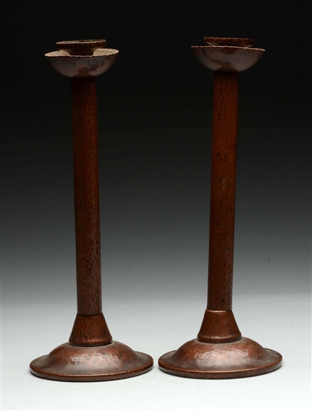 PAIR OF HAND HAMMERED COPPER ARTS & CRAFTS CANDLESTICKS. 