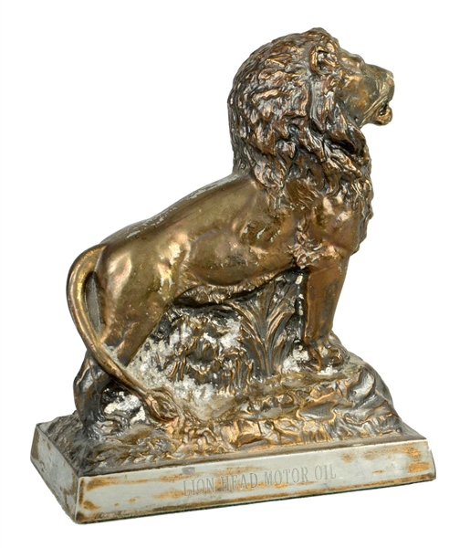 VERY RARE GILMORE LION CAST METAL PAPERWEIGHT.