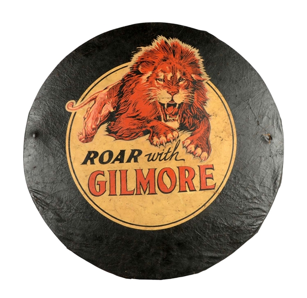 ROAR WITH GILMORE TIRE COVER WITH LEAPING LION GRAPHIC.