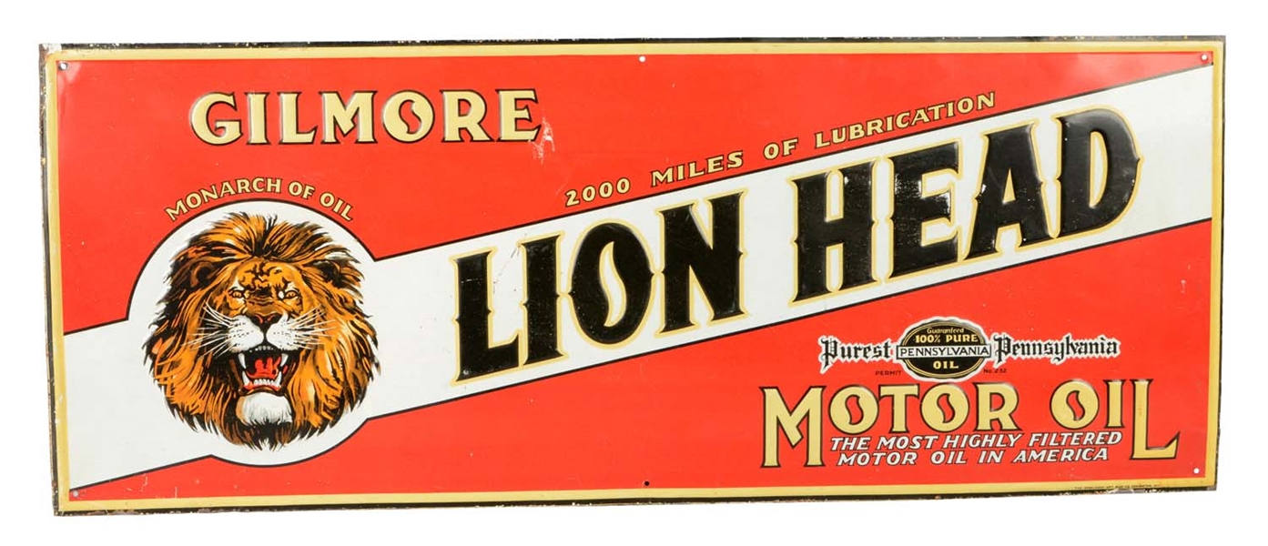 GILMORE LION HEAD EMBOSSED TIN TACKER SIGN.