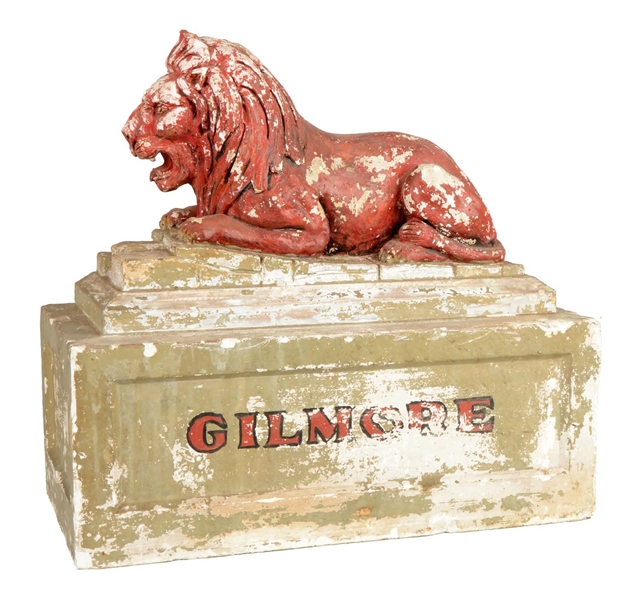 PLASTER LION STATUE WITH GILMORE SCRIPT.