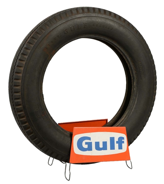 GULF TIRE AND TIRE STAND.