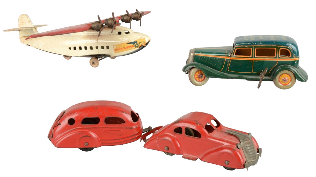 LOT OF 3: ASSORTED TIN TOYS.