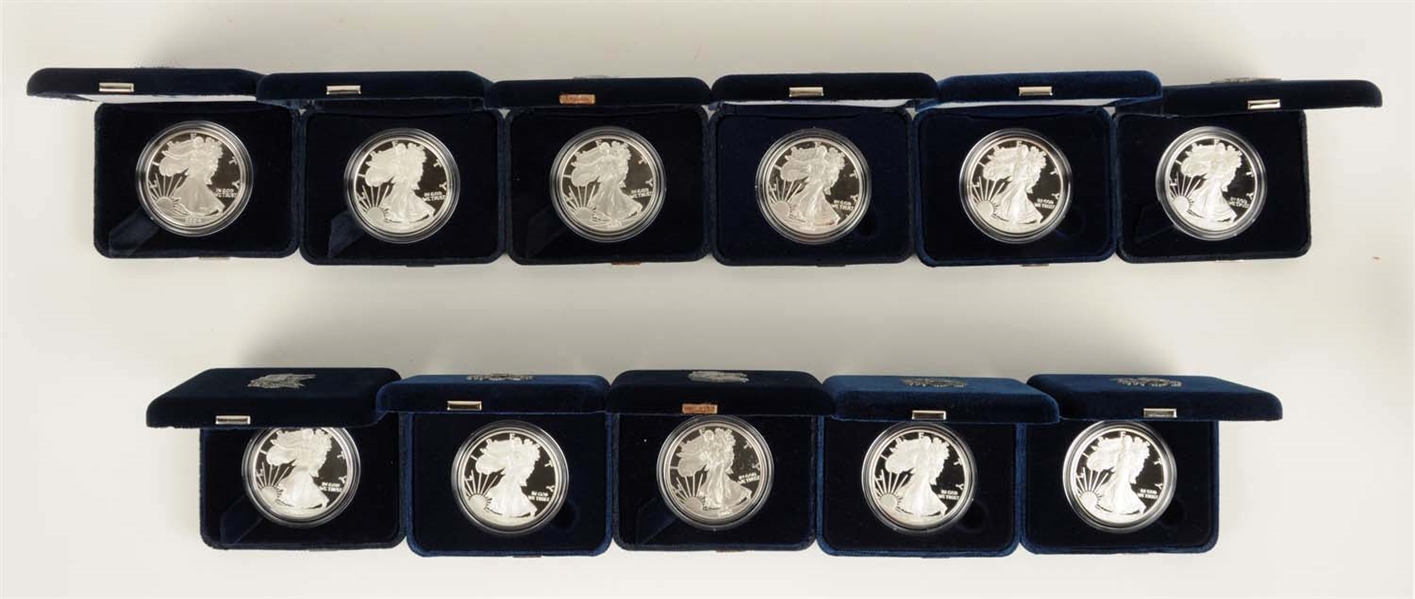 LOT OF 11: AMERICAN EAGLE SILVER COINS.