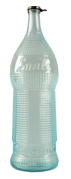 "CHOCOLATE FLAVOR" CLEAR GLASS OVERSIZED SMILE BOTTLE DISPLAY.