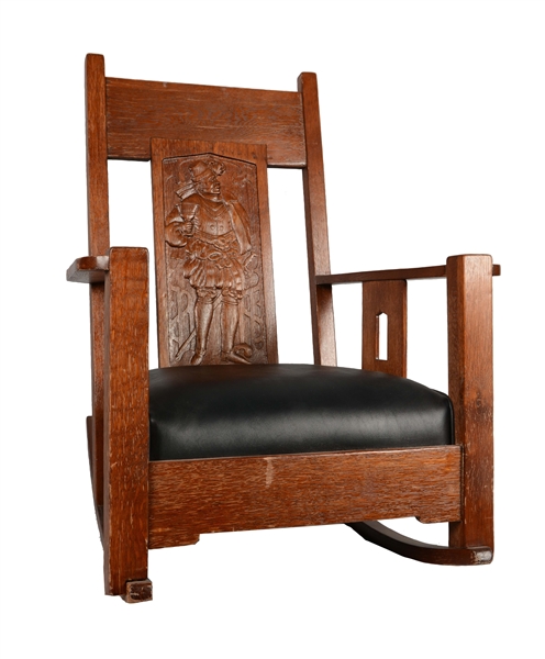 CARVED OAK ROCKING CHAIR. 
