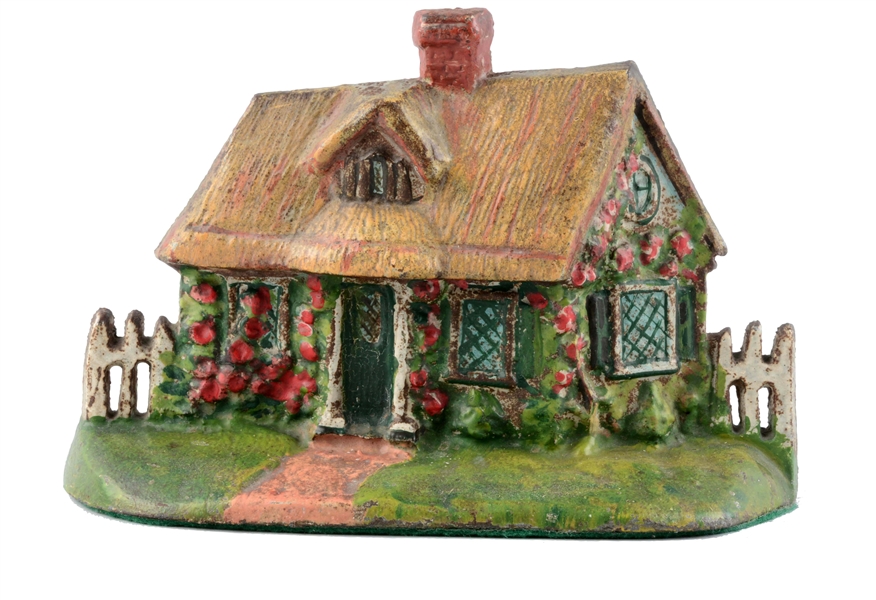CAST IRON CAPE COD COTTAGE WITH THATCHED ROOF DOORSTOP. 
