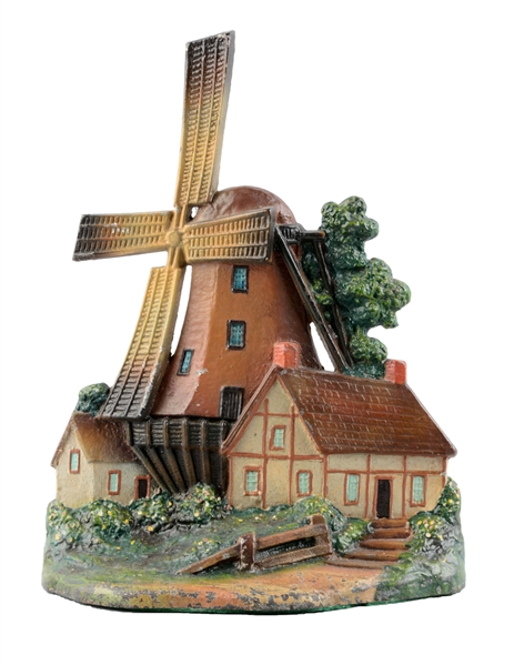 CAST IRON WINDMILL WITH COTTAGES DOORSTOP.