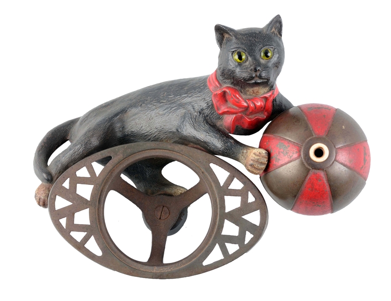 CAST IRON CAT WITH BALL MILLINER’S BINDING HOLDER.