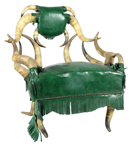 HORNED ARMCHAIR WITH GREEN UPHOLSTERY. 