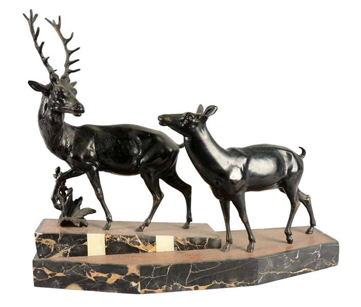 MIXED MEDIA STAG AND DOE SCULPTURE. 