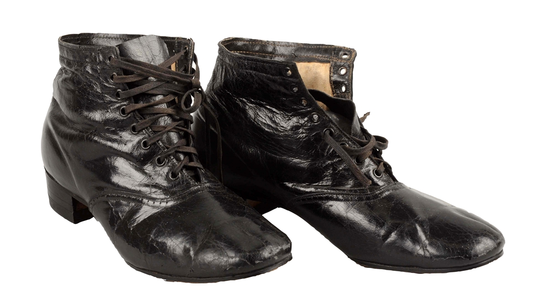 EARLY PAIR OF BLACK LEATHER SHOES.