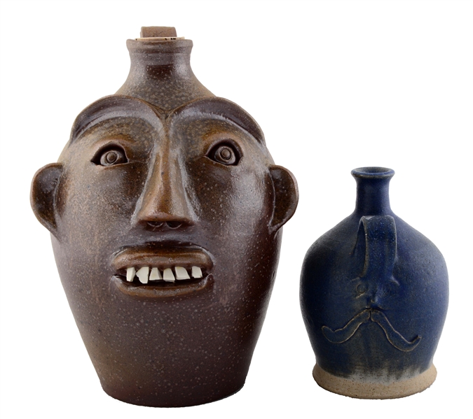 LOT OF 2: UGLY FACE & NORTH WIND FACE JUGS. 