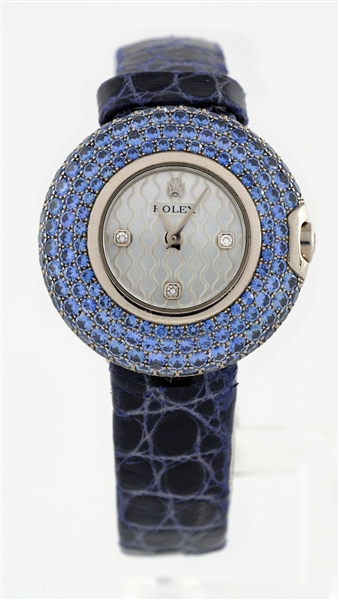 ROLEX LADIES CELLINI IN 18K WHITE GOLD WITH PAVE SAPPHIRE CASE AND BUCKLE.