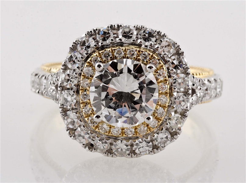 ROUND BRILLIANT 0.93 CT SET IN 18K WHITE AND YELLOW GOLD RING