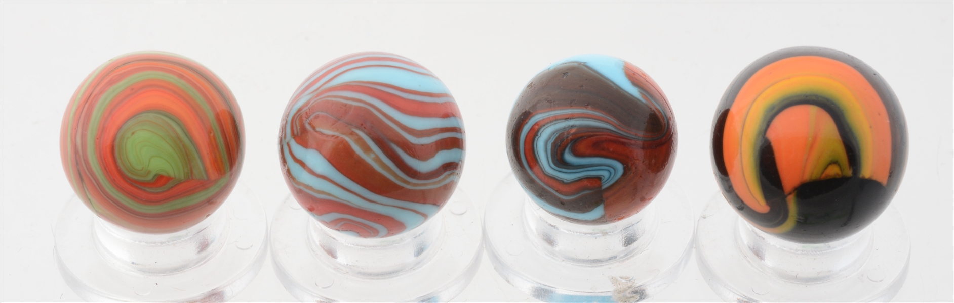 LOT OF 4: CHRISTENSEN DIAPER FOLD MARBLES.