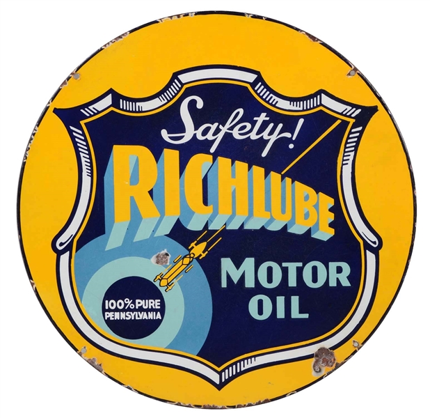 RICHLUBE MOTOR OIL PORCELAIN SIGN WITH RACE CAR GRAPHICS.