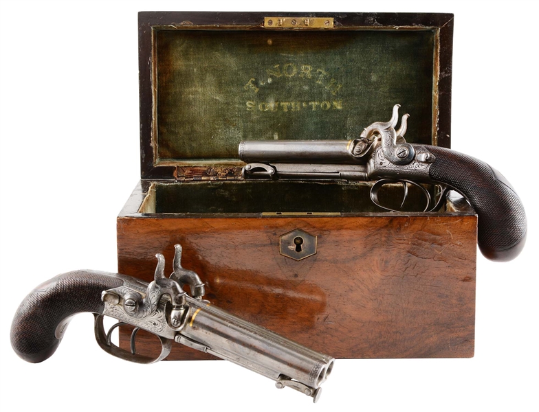 (A) CASED PAIR OF ENGLISH DOUBLE BARREL PERCUSSION PISTOLS BY T. NORTH.