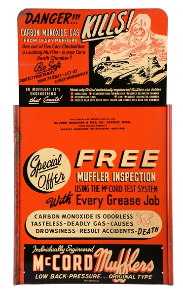 MCCORD MUFFLERS TIN CURB SIDE SIGN WITH SKULL GRAPHICS. 