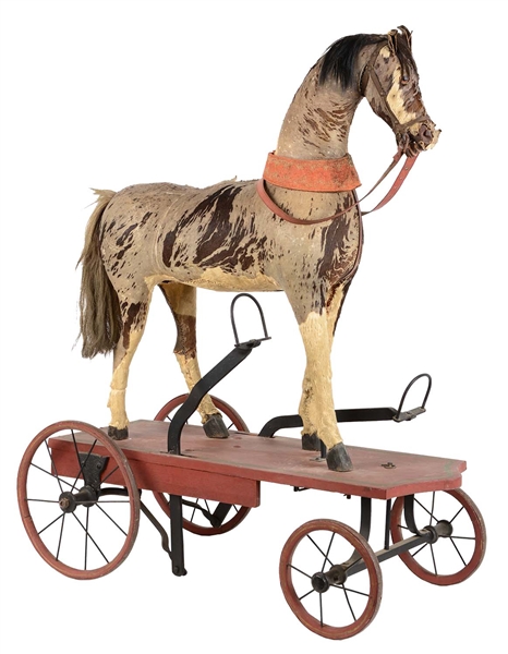 CHILDRENS WOODEN HOBBY HORSE ON PLATFORM WITH WHEELS.