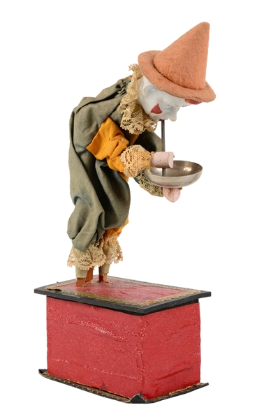 EARLY GERMAN BISQUE HEAD BUBBLE BLOWING PLATFORM TOY. 