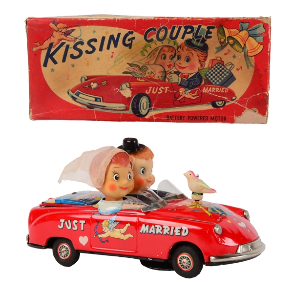 JAPANESE TIN LITHO BATTERY OPERATED KISSING COUPLE CAR.