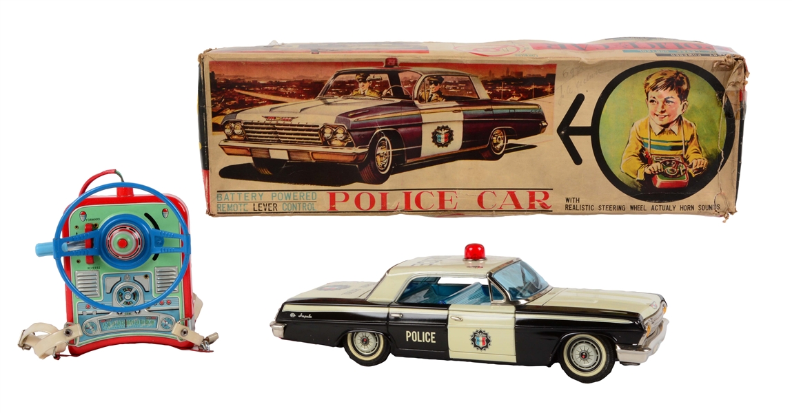 RARE JAPANESE TIN LITHO BATTERY OPERATED POLICE CAR IN BOX. 