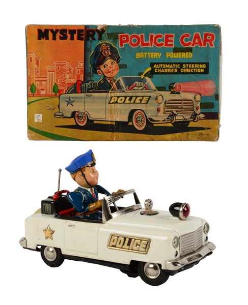 JAPANESE TIN LITHO BATTERY OPERATED MYSTERY POLICE CAR IN BOX. 