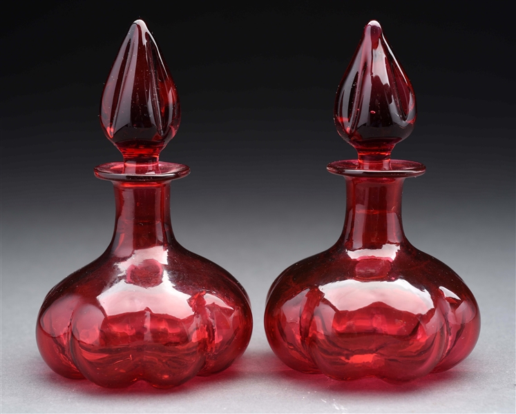 LOT OF 2: STEUBEN CRANBERRY OR RUBY PERFUME BOTTLES.