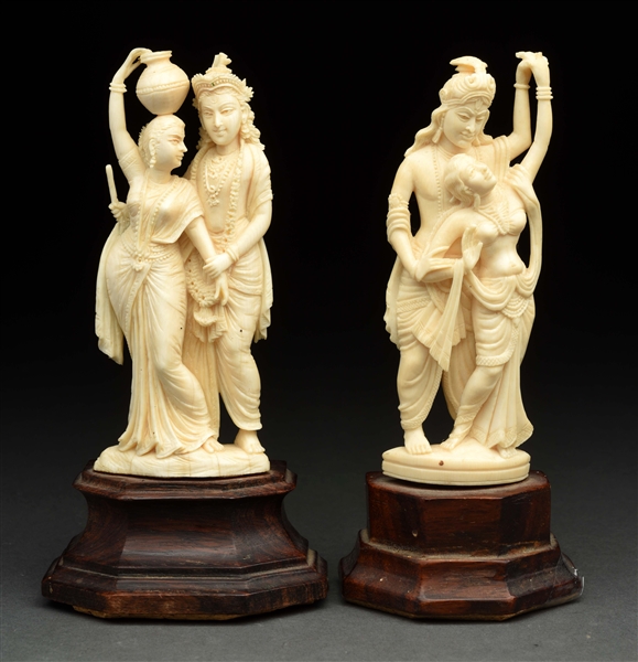 LOT OF 2: CARVED IVORY COUPLES ON STANDS. 