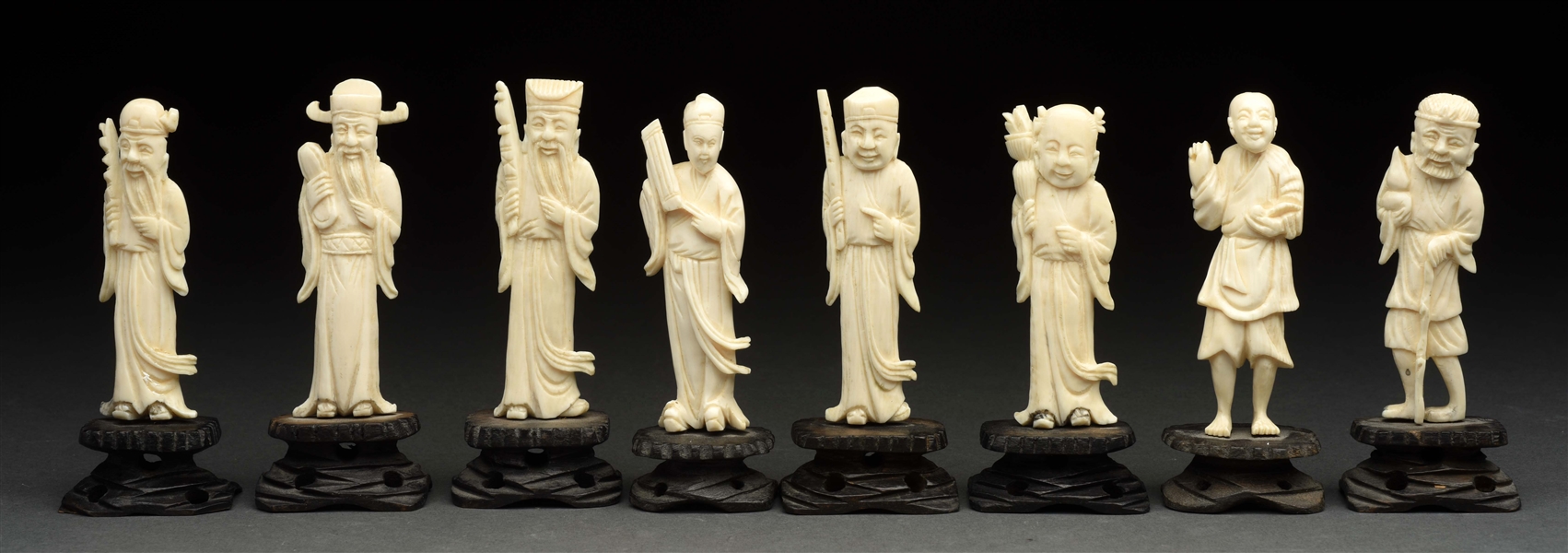 LOT OF 8: JAPANESE IVORY MEN ON STANDS. 