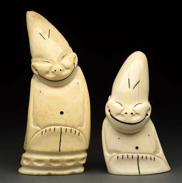 PAIR OF WHALES TEETH WITH CARVED FACES. 
