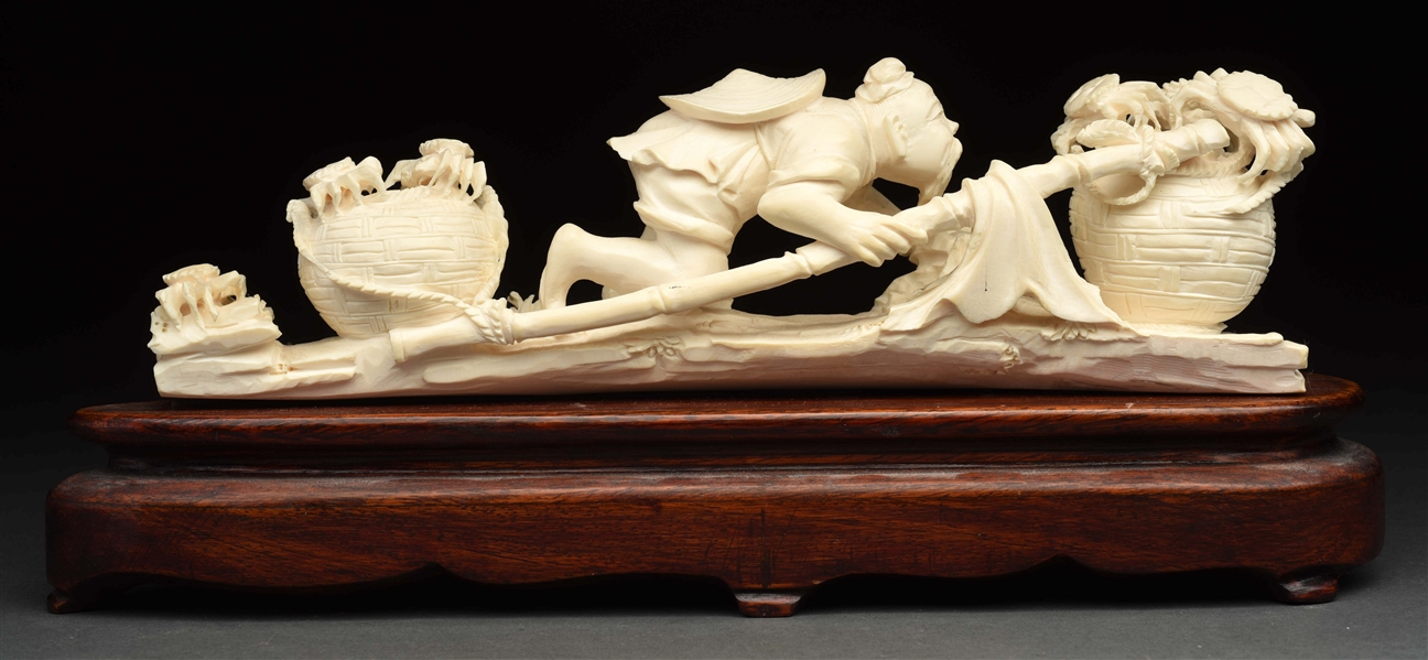 CHINESE CARVED IVORY FIGURE OF MAN CATCHING CRABS. 