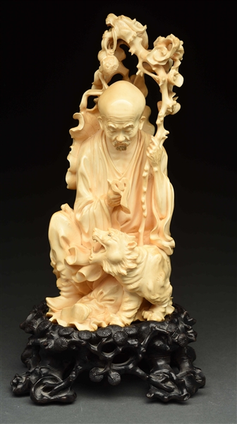 HIGHLY CARVED CHINESE FIGURE OF MAN READING BOOK. 