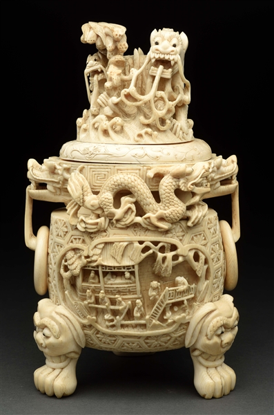 HIGHLY CARVED LIDDED URN WITH DRAGONS. 