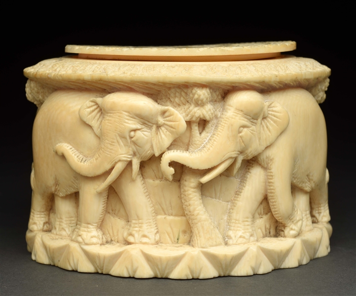 HIGHLY CARVED IVORY LIDDED BOX. 