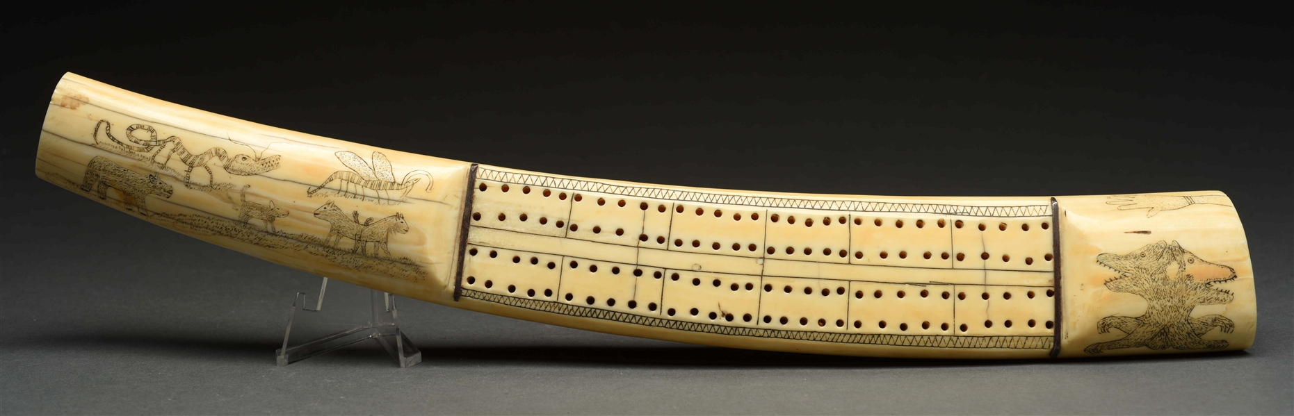 IVORY TUSK WITH CRIBBAGE BOARD AND SCRIMSHAW. 