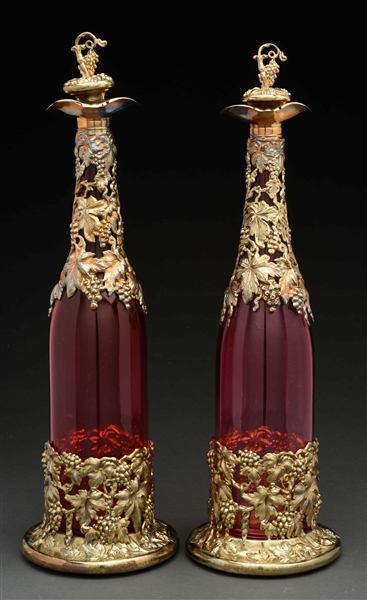 PAIR OF RUBY GLASS DECANTERS. 