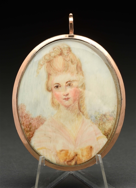 LARGE HAND PAINTED LADY ON IVORY PENDANT IN 9K GOLD FRAME.