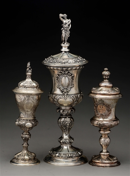 THREE CONTINENTAL SILVER COVERED CUPS.