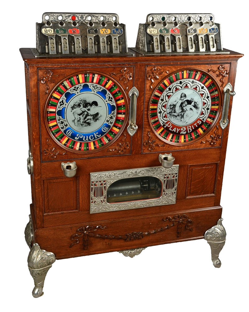 **5¢, 25¢ CAILLE BROS. DOUBLE MUSICAL PUCK UPRIGHT SLOT MACHINE. 