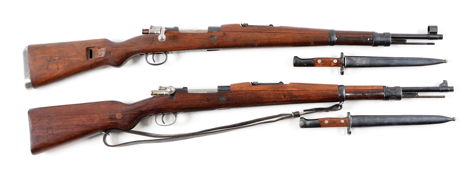 (C) LOT OF 2: YUGOSLAVIAN MILITARY MAUSER RIFLES WITH BAYONETS.