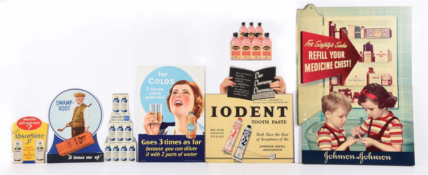 LOT OF 7: CUTOUT CARDBOARD ADVERTISING SIGNS.