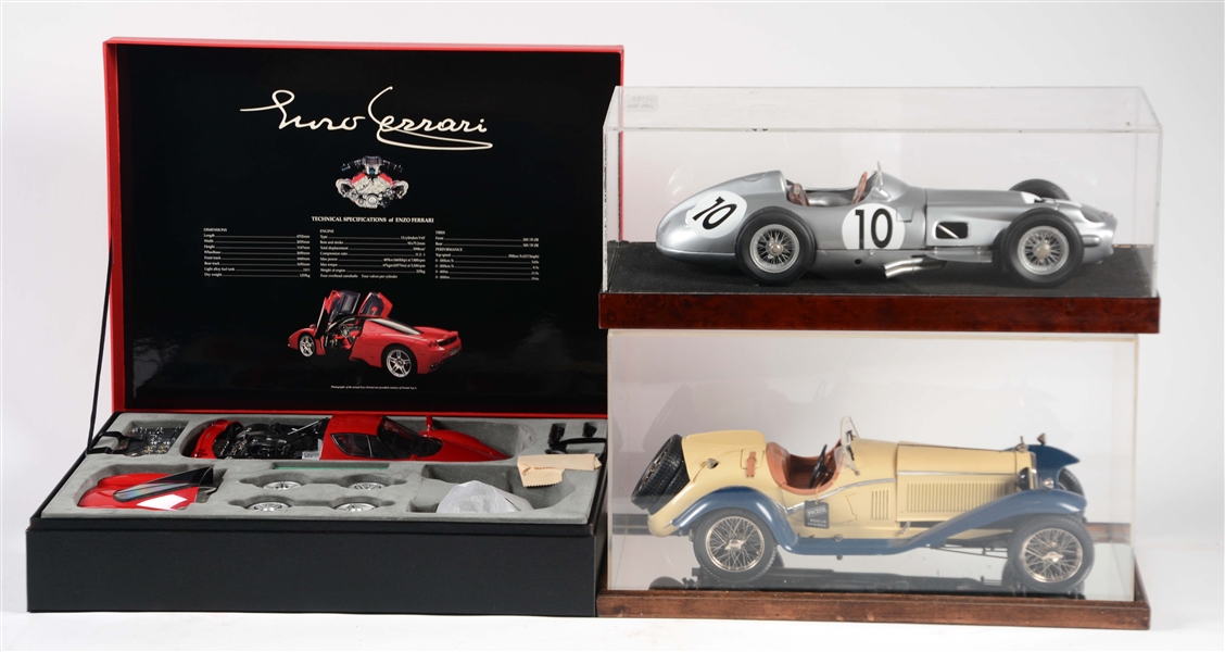 LOT OF 3: 1/12 SCALE ENZO FERRARI IN BOX & RACE CARS IN DISPLAY CASES