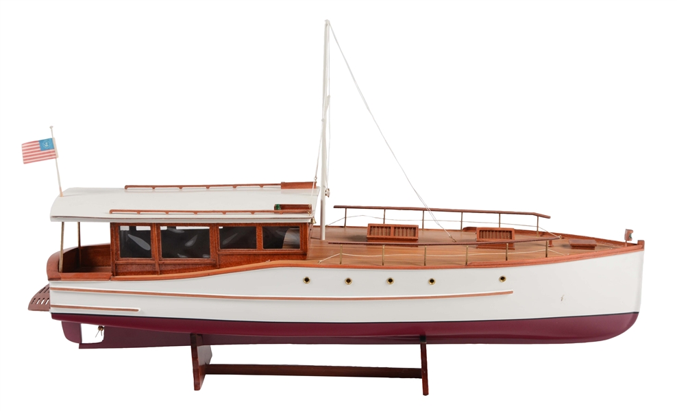 WOOD BOAT WITH MAST ON STAND.